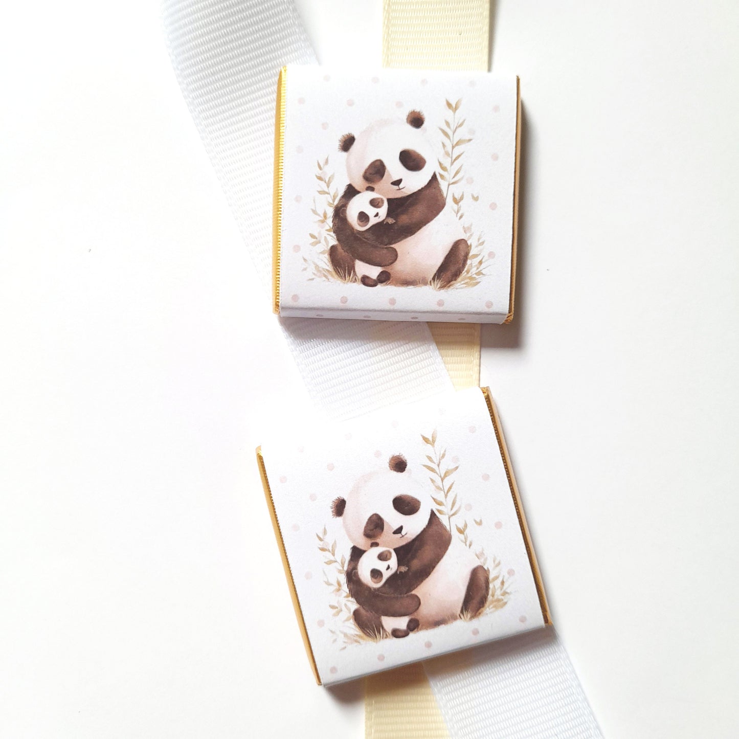 Charming, personalised chocolate favours featuring a mama and baby panda design. They are sold in packs of 25.