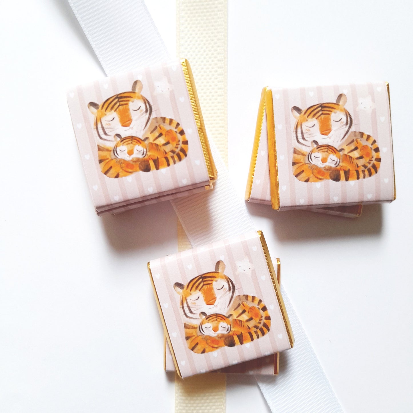 A pack of 25 personalized chocolate favours featuring a Mama Tiger theme, perfect for baby showers, first birthdays, and other themed parties.
