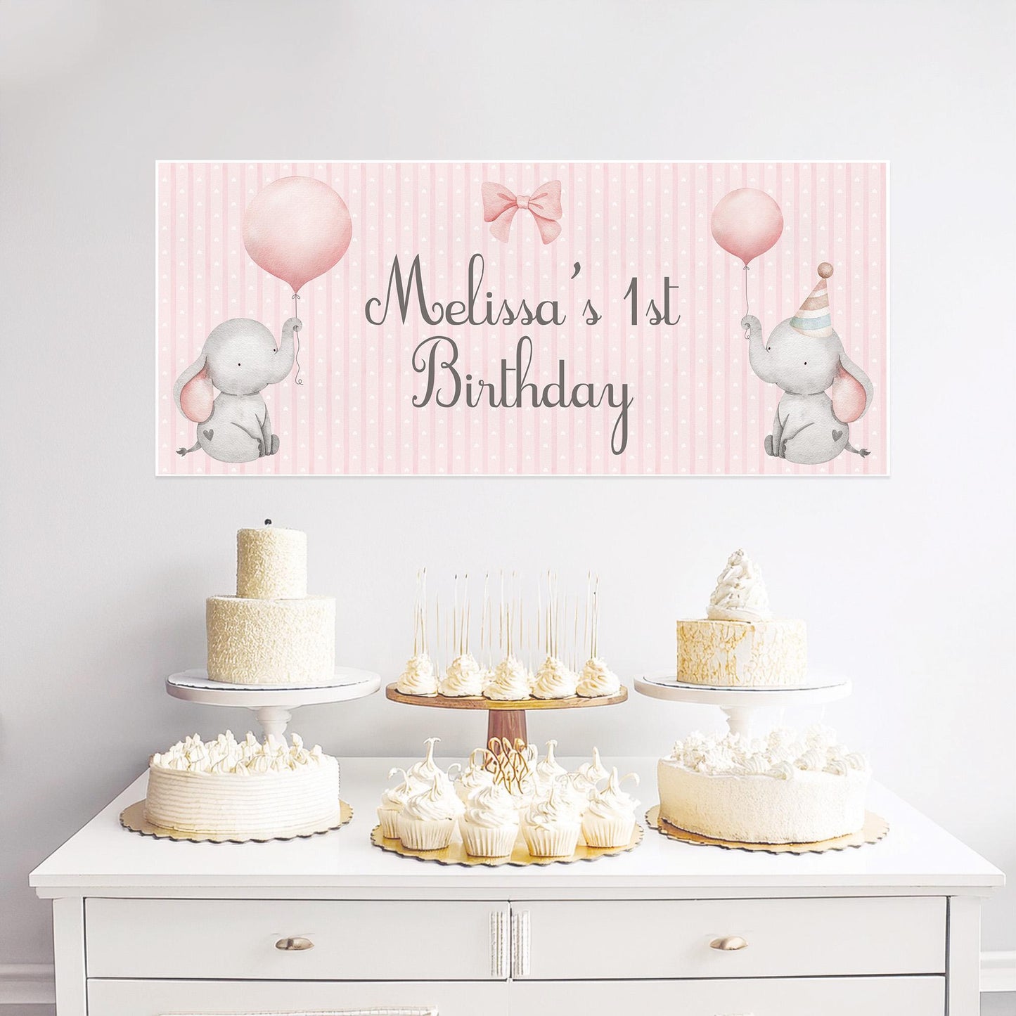 Personalised 1st birthday banner on luxury satin paper featuring a sweet pink baby elephant illustration with custom text option, approximately 43 cm × 1 m
