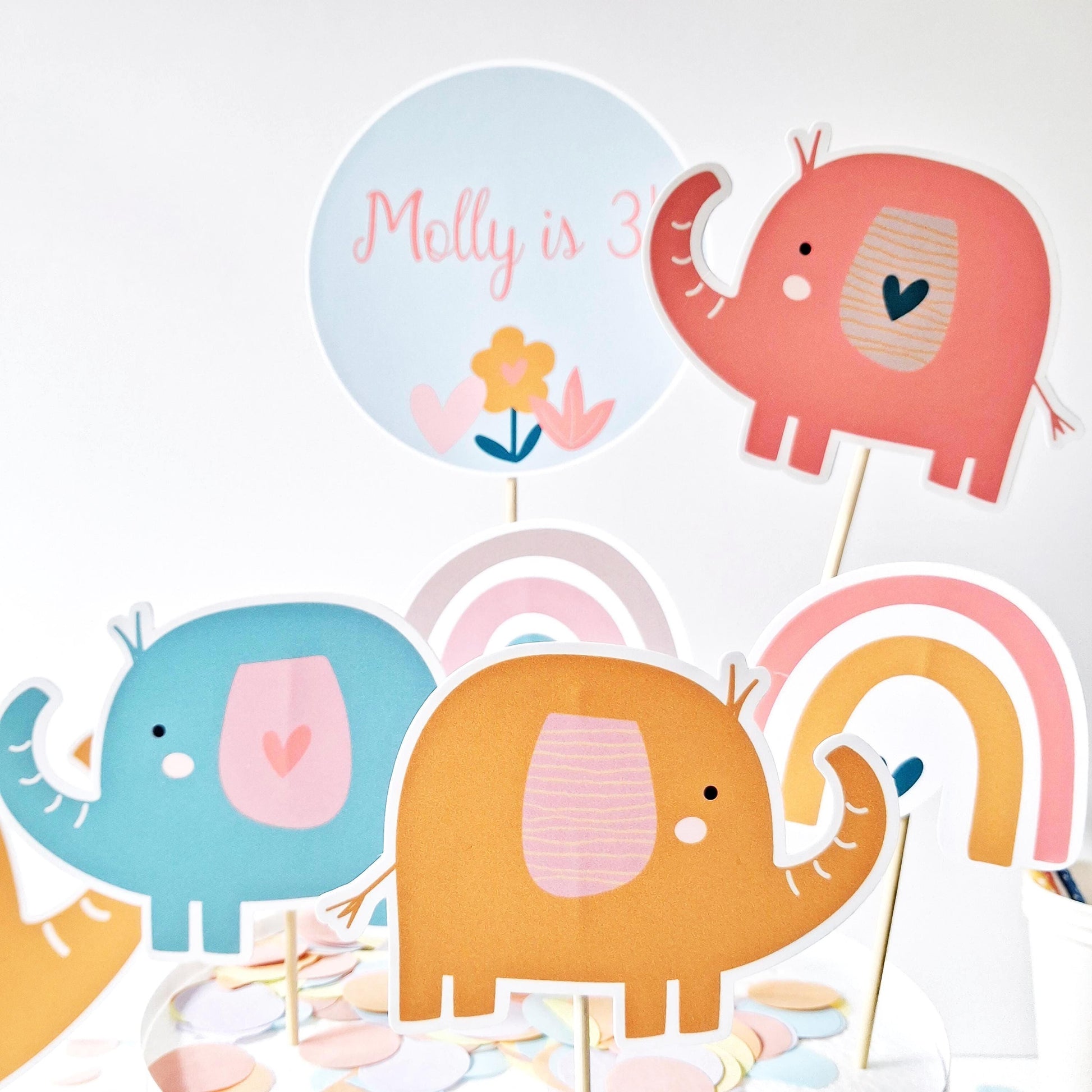Personalised Rainbow Elephant Cake Topper Set . Handmade in the UK.
Includes a personalized name and age topper.
    Comes with a coordinating figure.