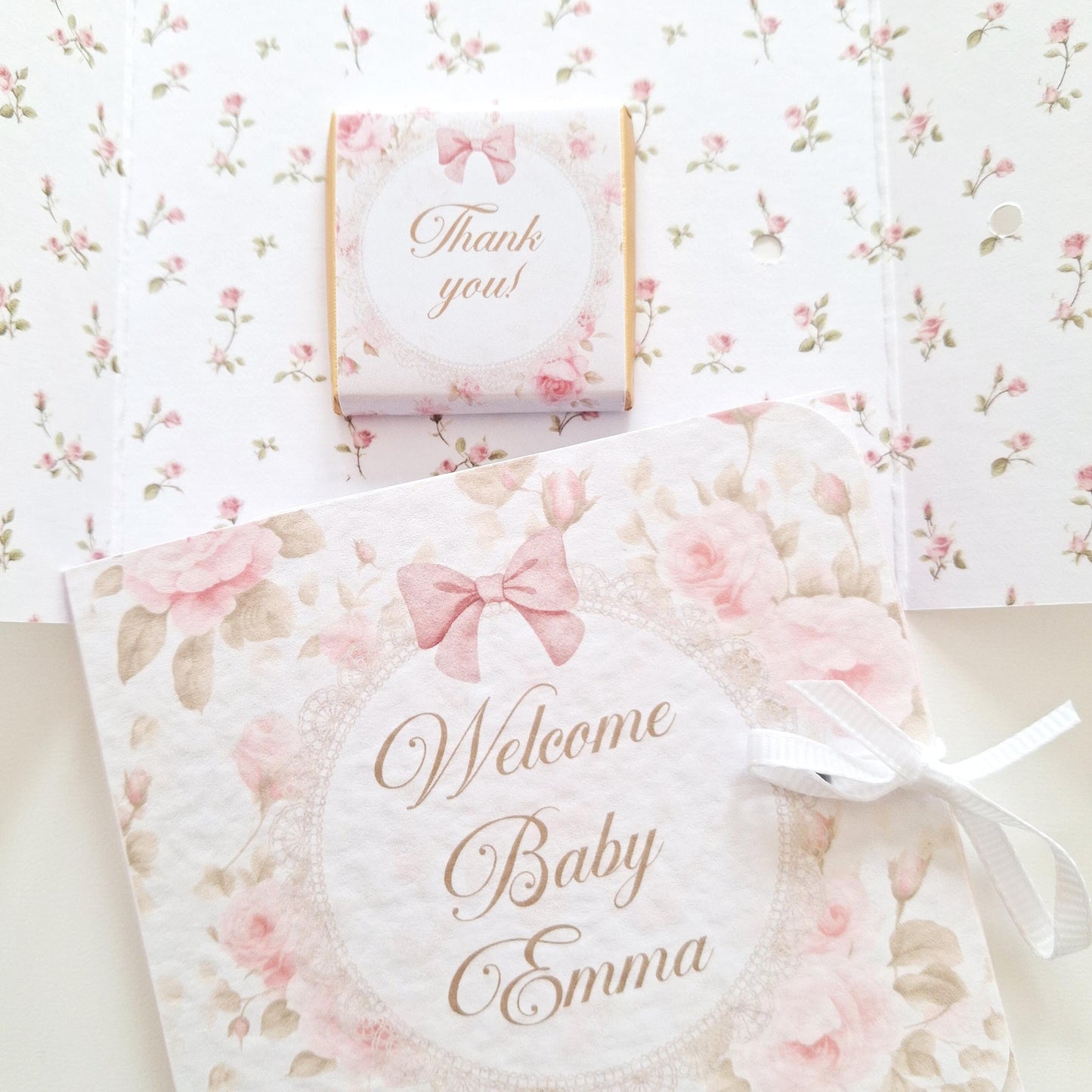 Personalised Welcome Baby Girl Favours – Chocolate Thank-You Gifts. Handmade in the UK, these are thank-you gifts for baby showers and christenings, containing chocolate and featuring a pink floral design