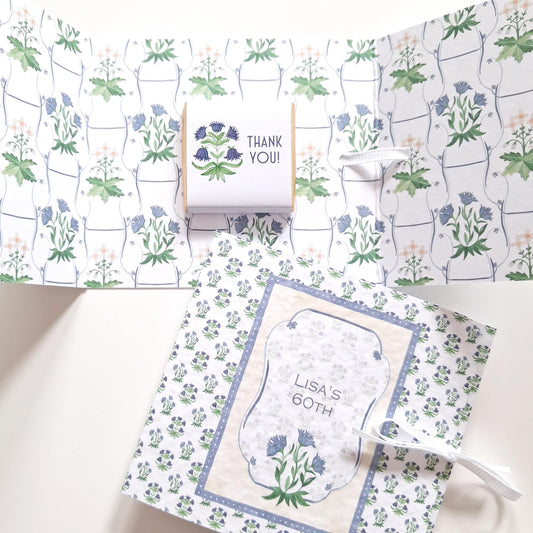 personalised milestone birthday favour, featuring floral blue designs and chocolate treats.