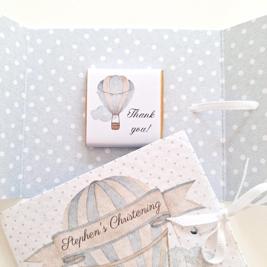 Personalised blue hot air balloon favours filled with chocolate. handmade in the UK and ideal for christenings, 1st birthdays, and other baby boy celebrations.