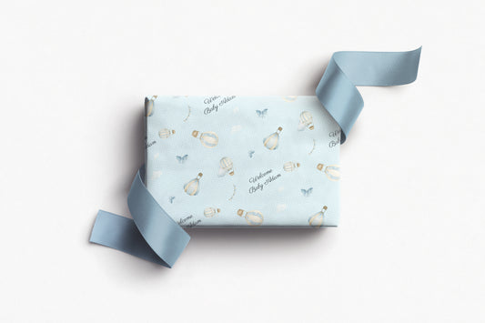 Personalised baby boy wrapping paper with blue hot air balloons and custom text