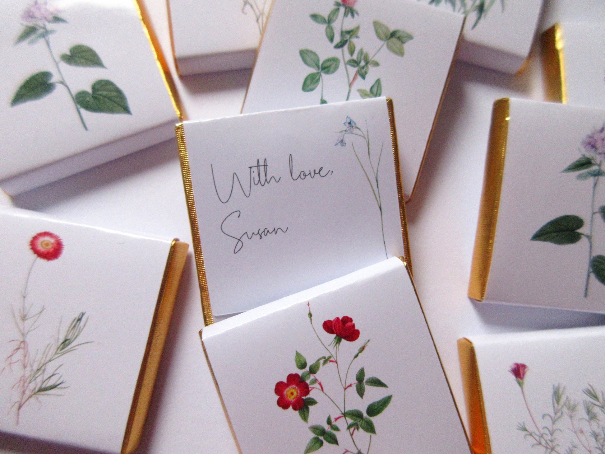 personalized chocolate for events like weddings and parties. Wild Flower Thank You Favours. The chocolates have botanical designs on the front and can be personalized on the back.