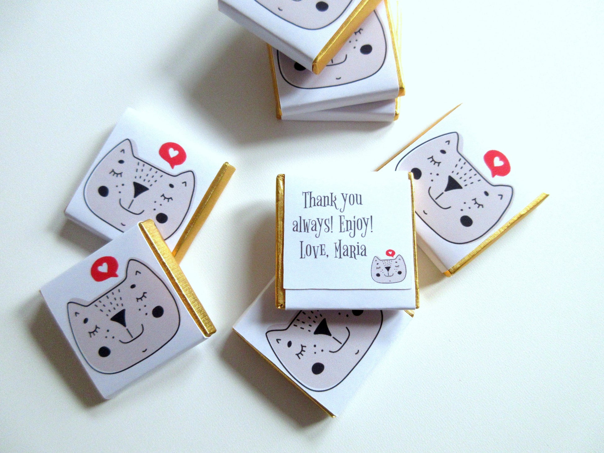 cat-face-shaped chocolate treats with personalised backs. Ideal for party bags, birthdays, and themed celebrations, especially for cat lovers.