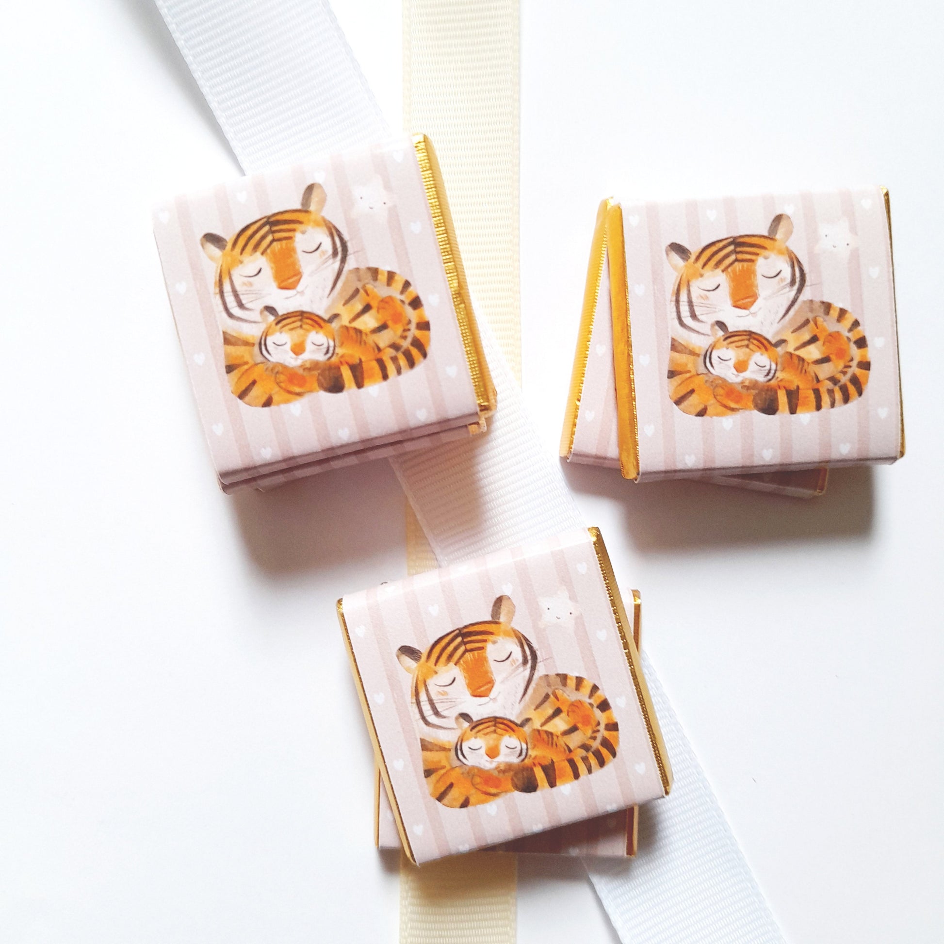 A pack of 25 personalized chocolate favours featuring a Mama Tiger theme, perfect for baby showers, first birthdays, and other themed parties.