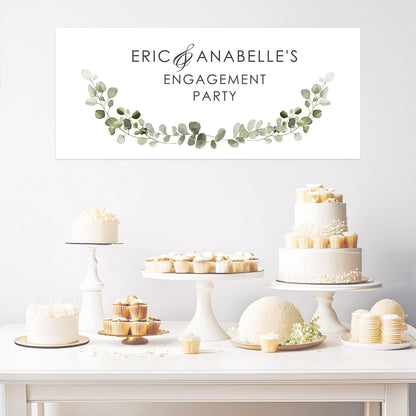 A personalised engagement party banner featuring a green botanical design