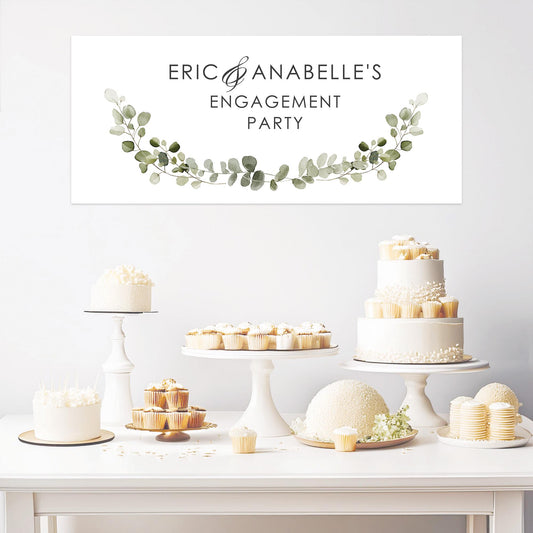 A personalised engagement party banner featuring a green botanical design