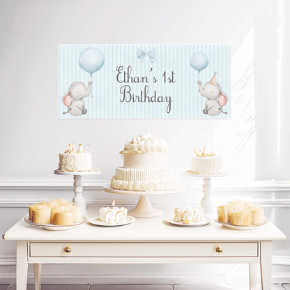 This product is a customizable baby elephant 1st birthday banner designed for boys in pastel blue.