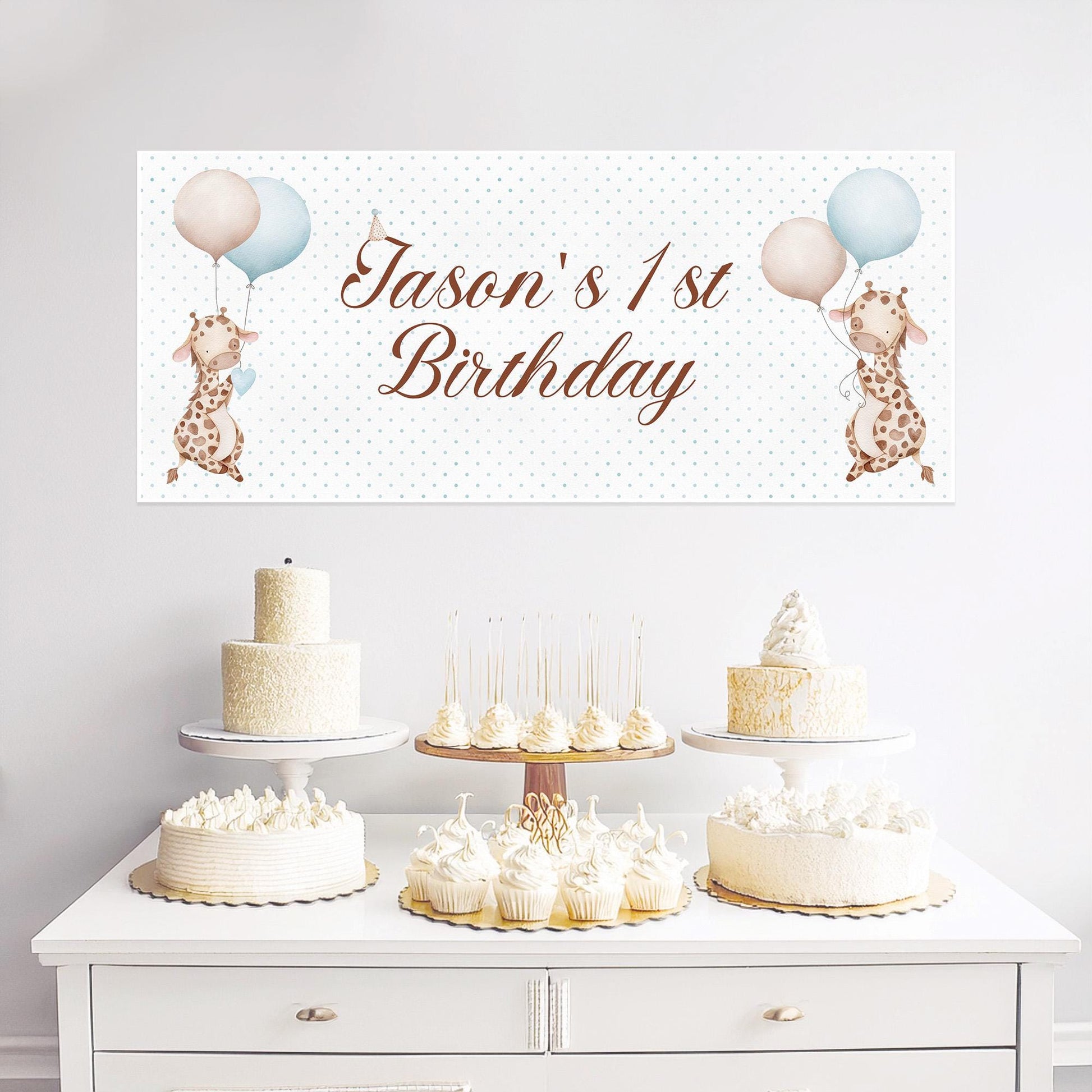 A personalized giraffe-themed 1st birthday banner designed for boys. It is made of high-quality satin paper and can include custom text.