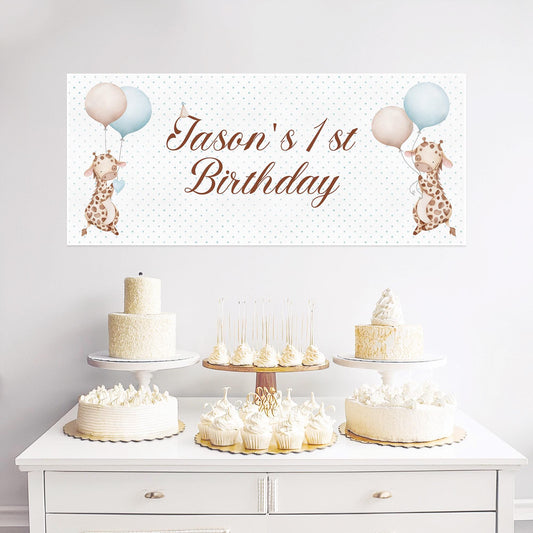 A personalized giraffe-themed 1st birthday banner designed for boys. It is made of high-quality satin paper and can include custom text.