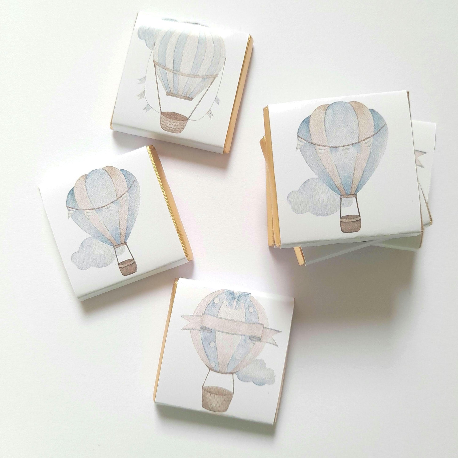 Personalised chocolates for baby shower favours, featuring a blue hot air balloon design.