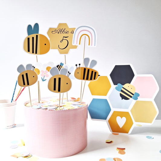  Personalised Bee Cake Topper Set – Bumblebee Birthday Party Decorations
This is a handmade-in-the-UK cake topper set. It includes a personalised topper with bumblebees, a rainbow, a cloud, and a honeycomb figure. designed for birthdays and bee-themed parties.