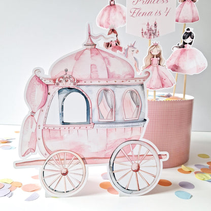 This is a handmade-in-the-UK cake topper set that includes a carriage, a unicorn, and princess figurines. It also comes with a personalised name and age topper, making it suitable for birthday celebrations.