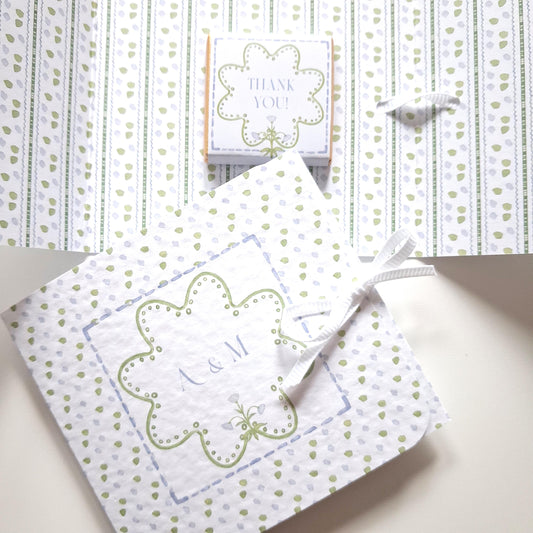 Elegant, personalised wedding favours with a blue and green design and chocolate.