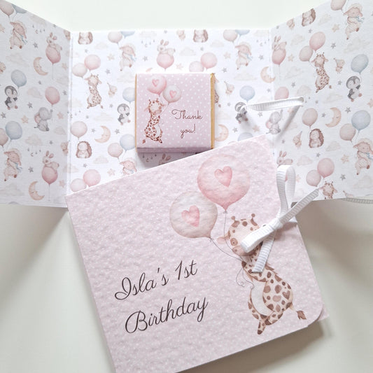 Handmade chocolate favours for a girl's first birthday, made in the UK. They are available in both milk and vegan chocolate options.